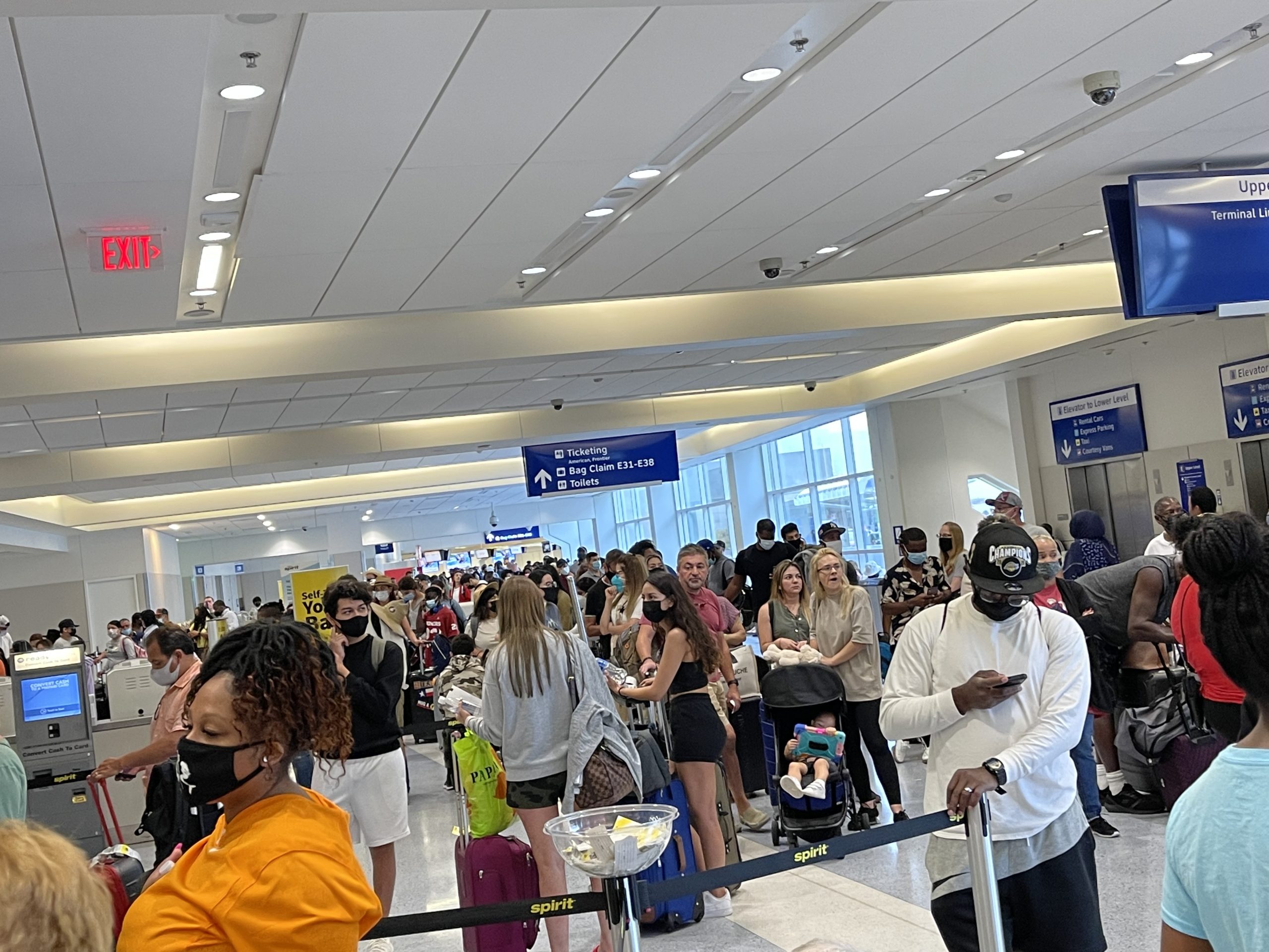 Travelers at Spirit Airlines counters at Dallas Fort Worth airport August 2