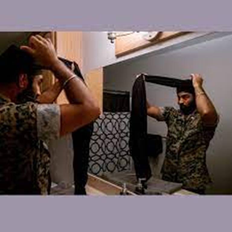 Sikh-American officer allowed to wear a turban with limitations may sue: Report