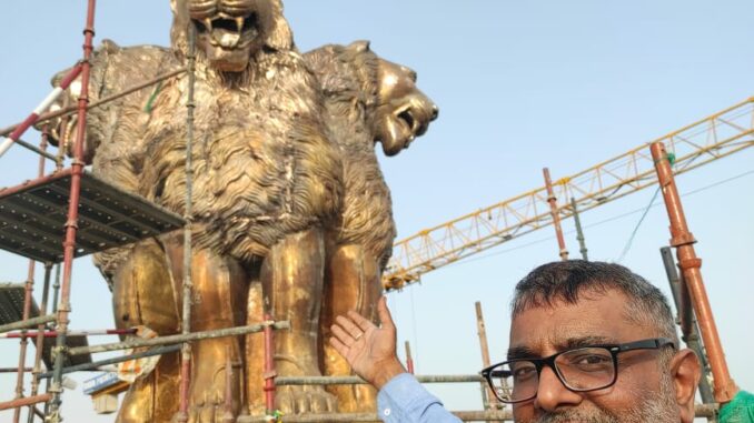 Laxman Vyas with newly sculpted National Emblem at new parliament building