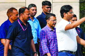 Delhi Chief Minister and AAP convenor Arvind Kejriwal comes out of the Rouse Avenue Court after he was produced by the Enforcement Directorate in the excise policy-linked money laundering case. (Source: PTI)