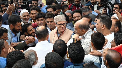 Omar Abdullah is surrounded by supporters in Srinagar
